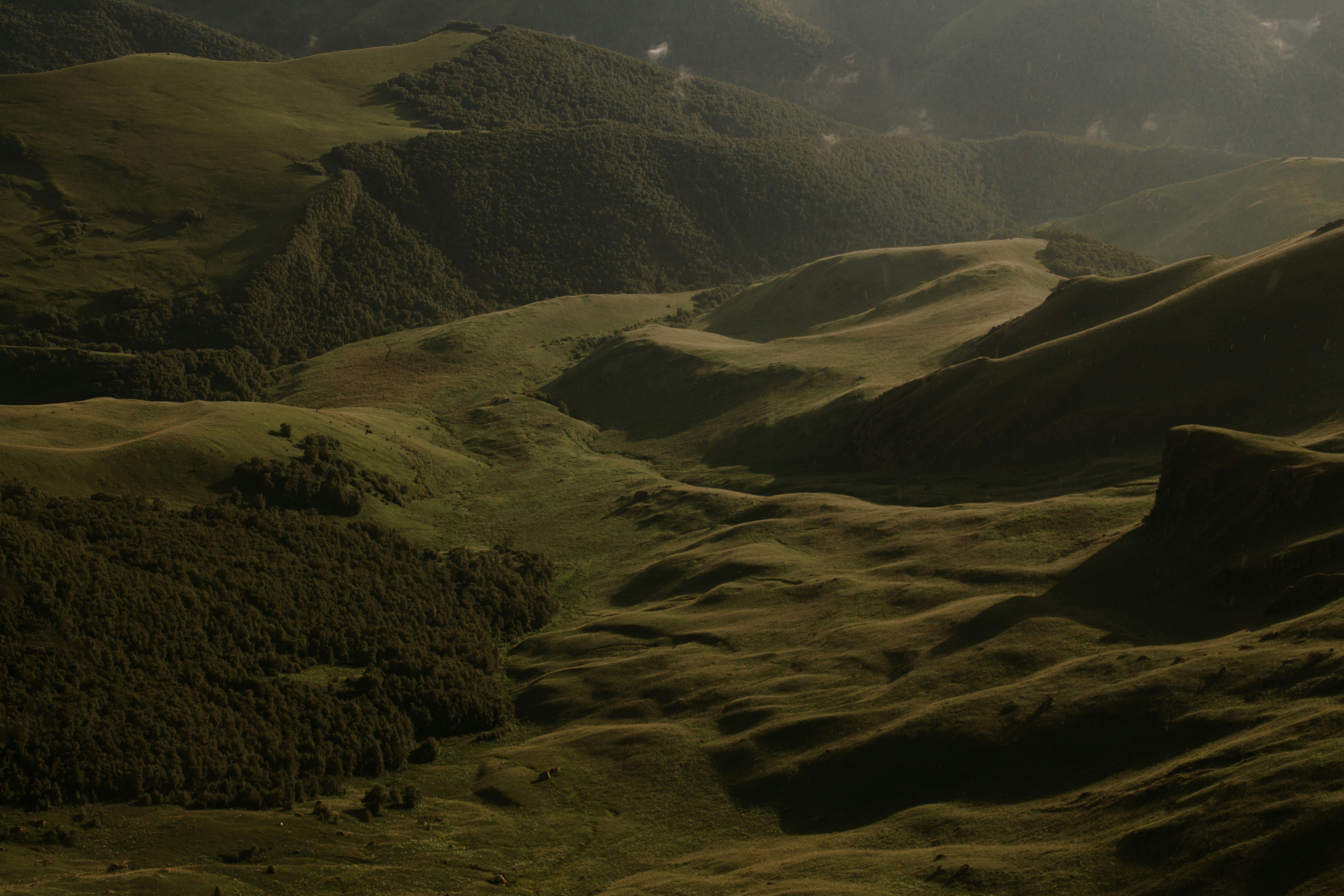 green and brown mountains under blue sky during daytime